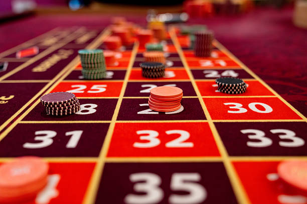 Live dealer table interface on mobile phone showing real dealer and betting controls